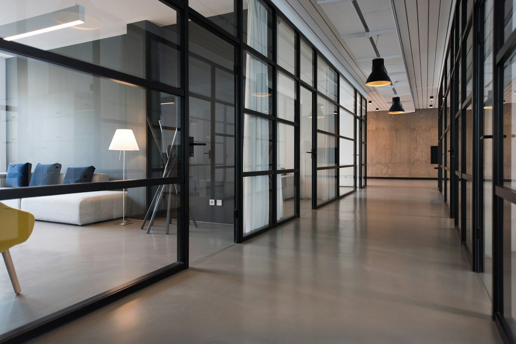Open, light-filled studio with tables and lounge areas