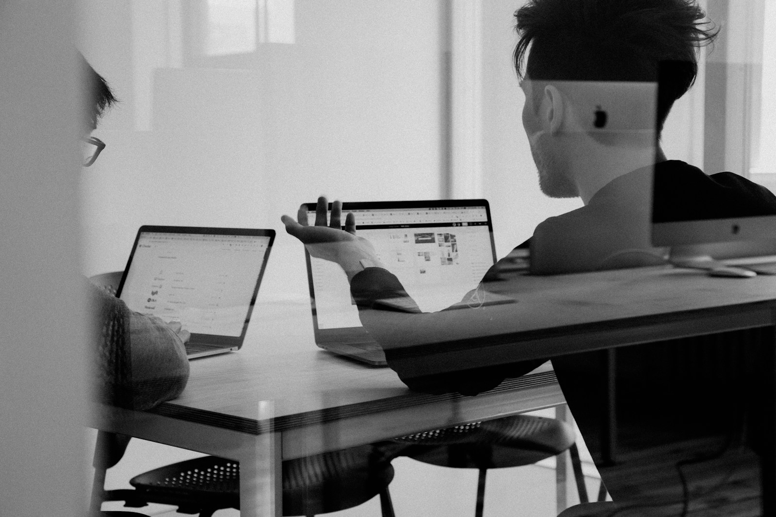 Team reviewing work together around a table